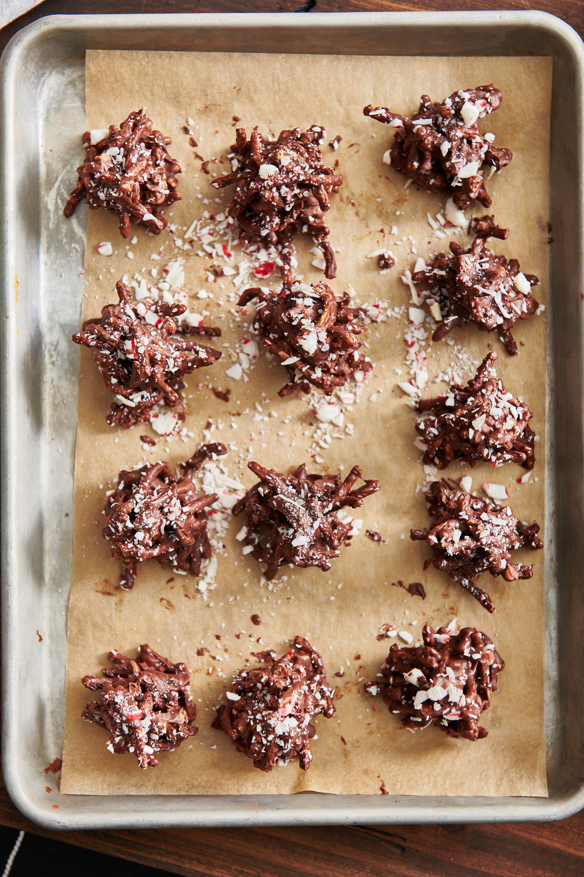 Lined baking sheet of Peppermint Bark Haystack Cookies.