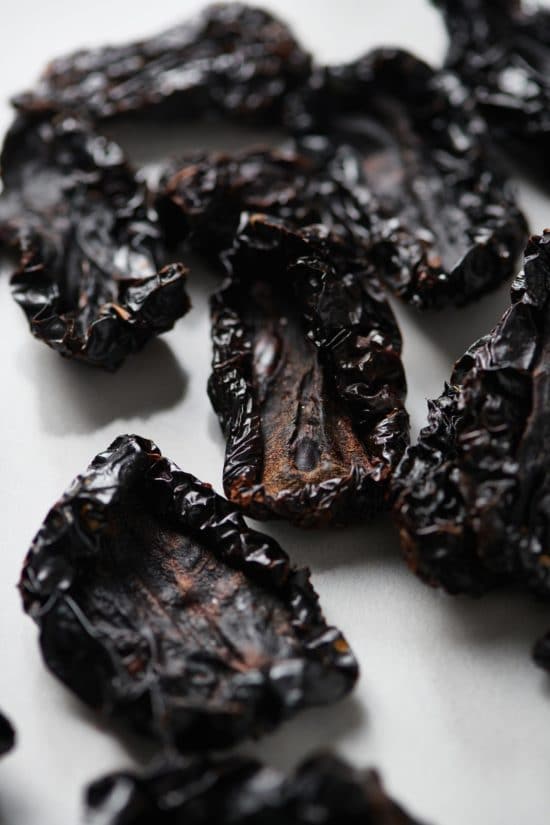 Dried tomatoes on parchment paper.