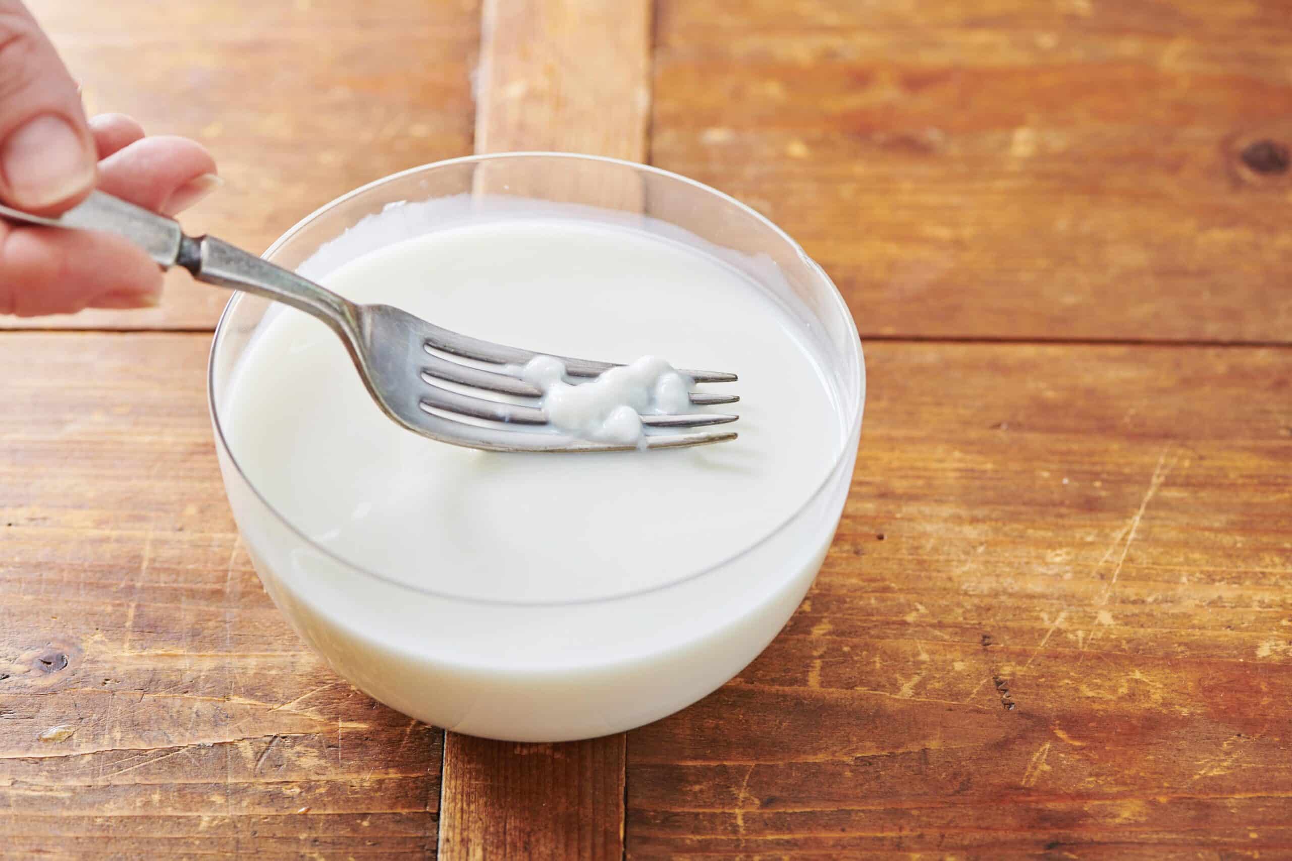 Fork mixing buttermilk.