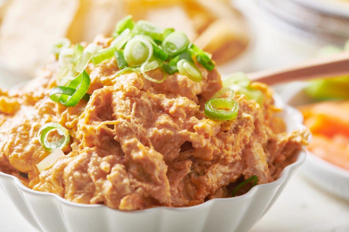 Buffalo Chicken Dip topped with chopped scallions.