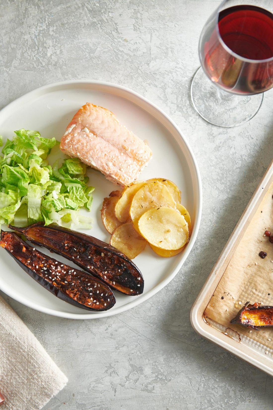 Plate of Japanese Miso Eggplant, fish, potato, and salad.