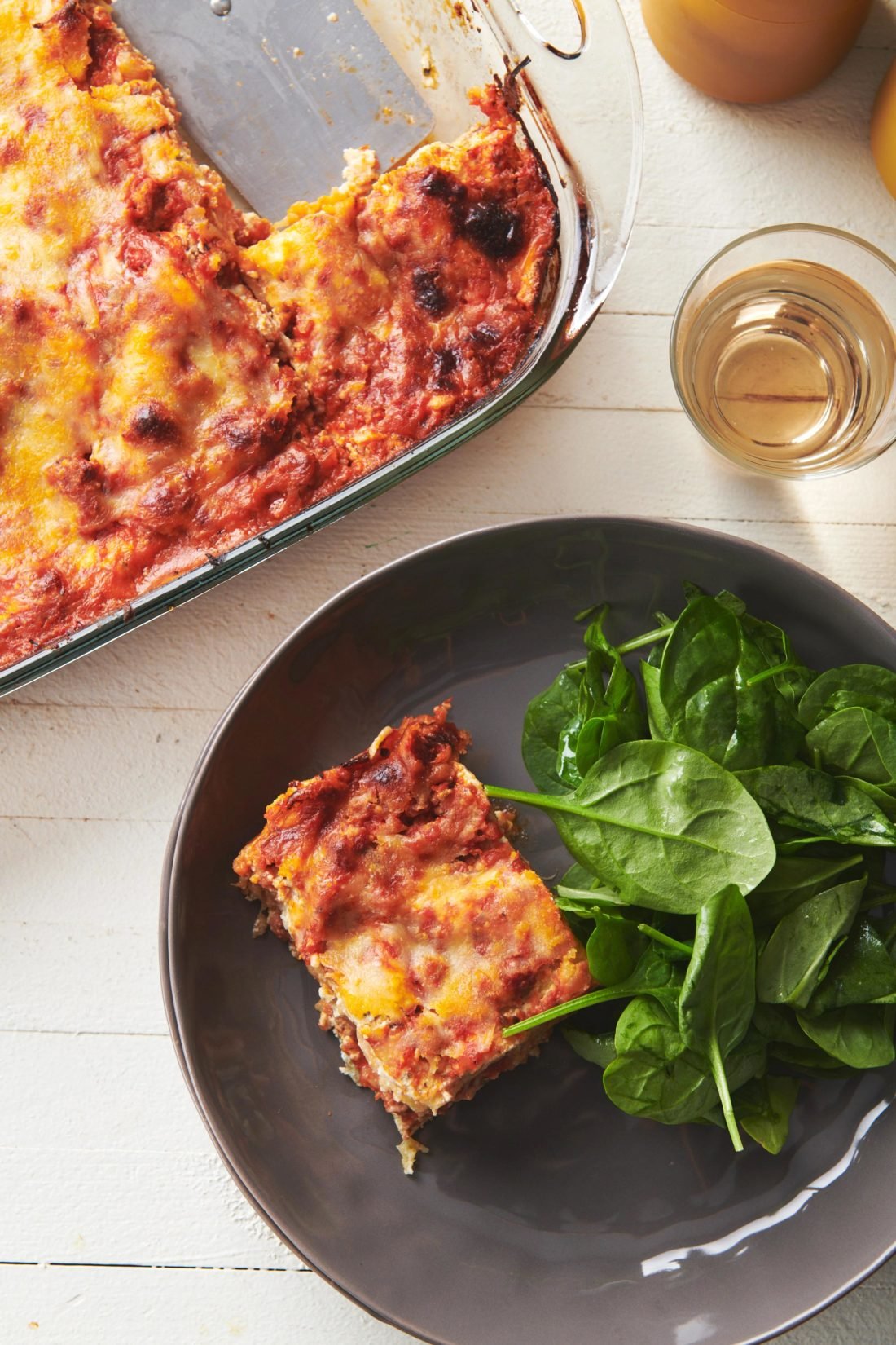 Turkey Lasagna on a plate with spinach.