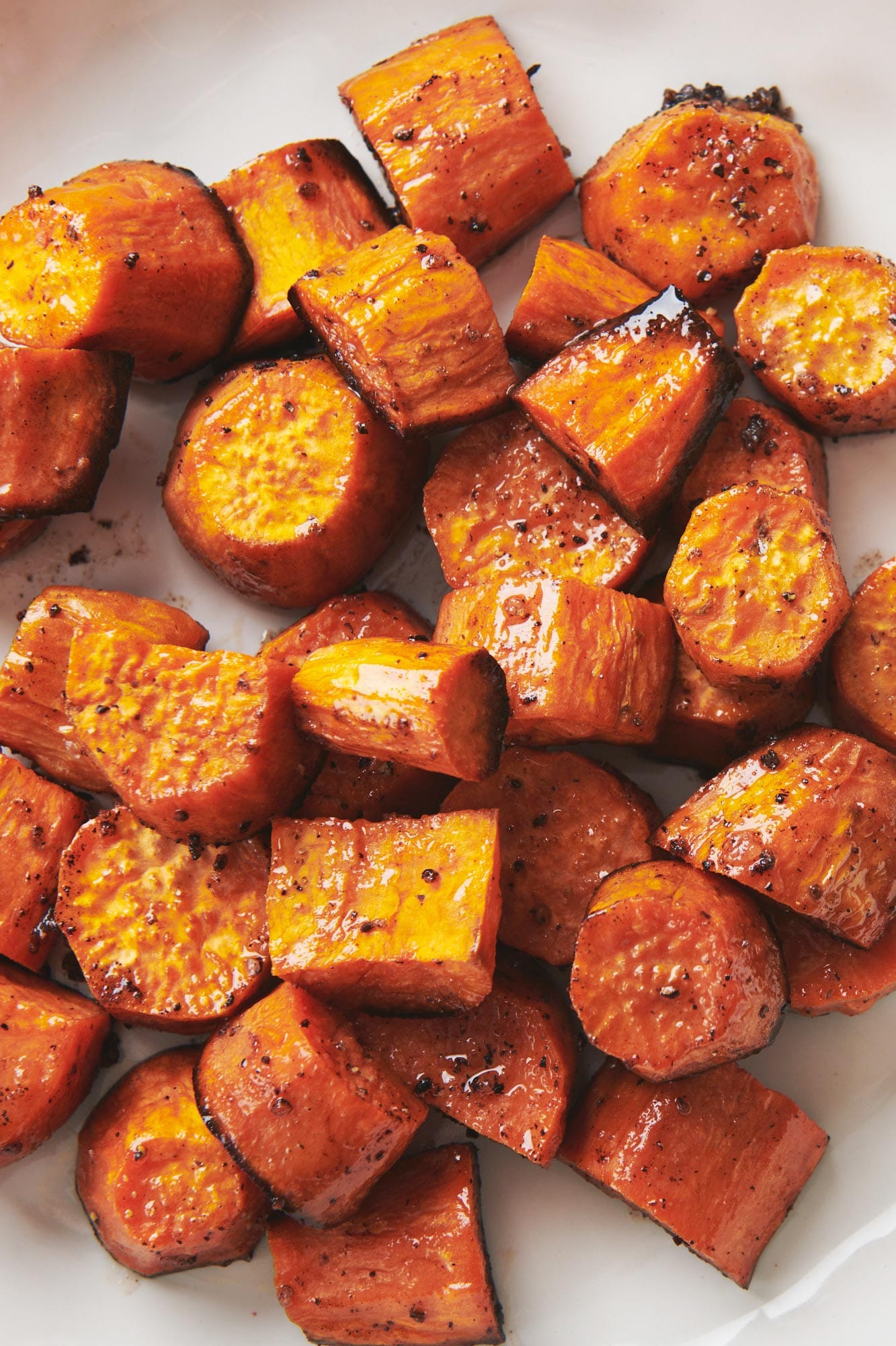 Butter-Roasted Sweet Potatoes on parchment paper.