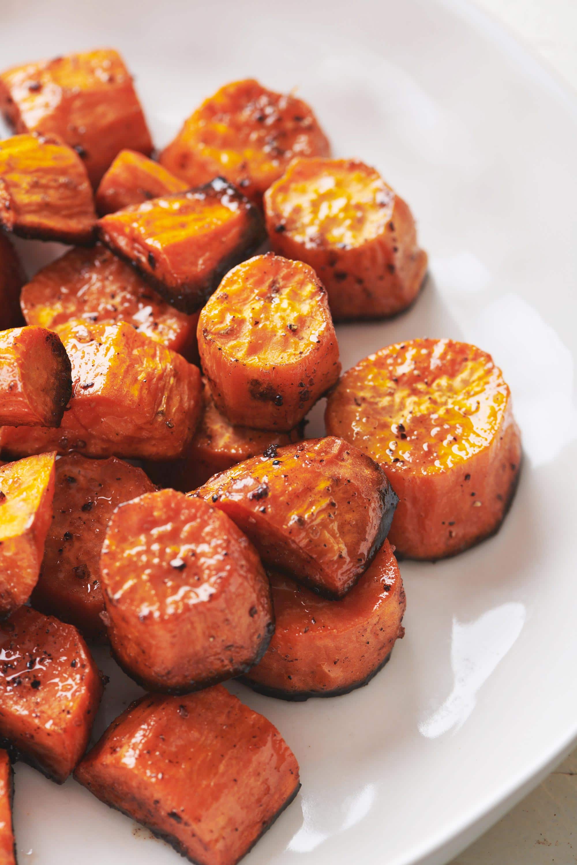 Butter-Roasted Sweet Potatoes piled on a plate.