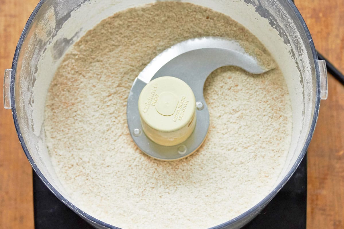 Blended flour, cinnamon, and other streusel ingredients in food processor.