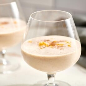 Homemade (Eggless!) Egg Nog in brandy snifters.