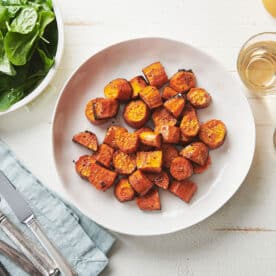 White plate of Butter-Roasted Sweet Potatoes