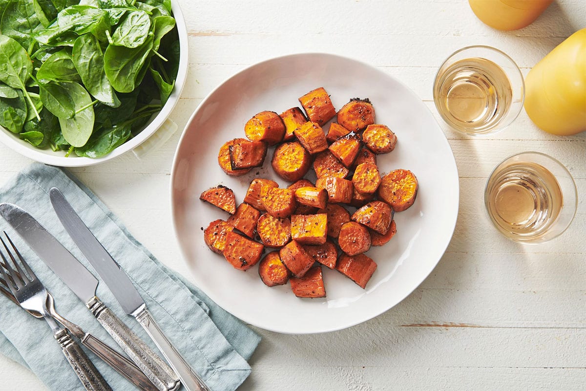 White plate of Butter-Roasted Sweet Potatoes