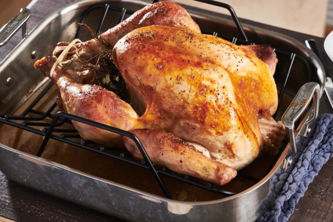 Roasting pan with a Roasted Thanksgiving Turkey.