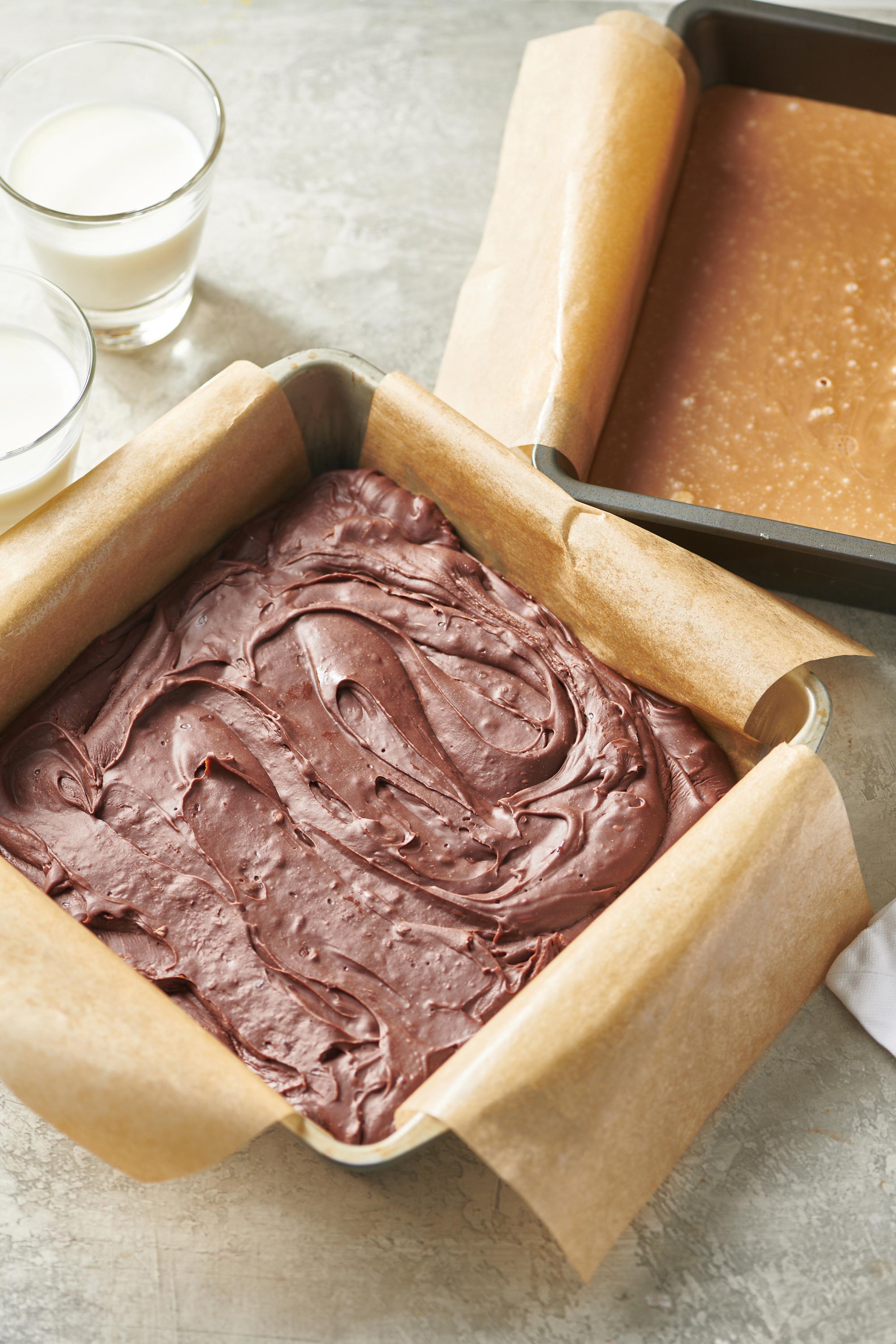 Easy Chocolate Fudge in a pan next to Penuche.