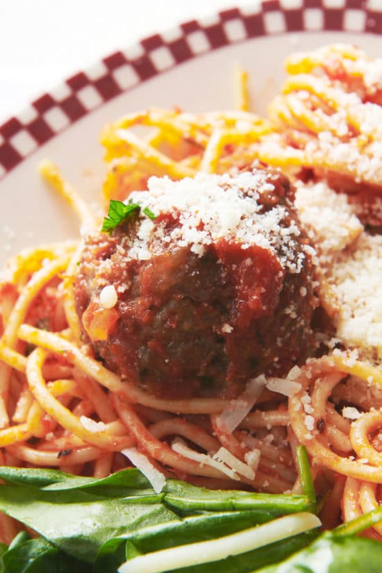 Italian Meatball on a bed of spaghetti.