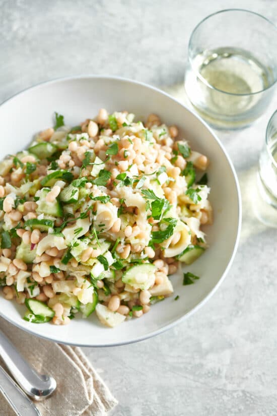 White bowl of White Bean and Hearts of Palm Salad.