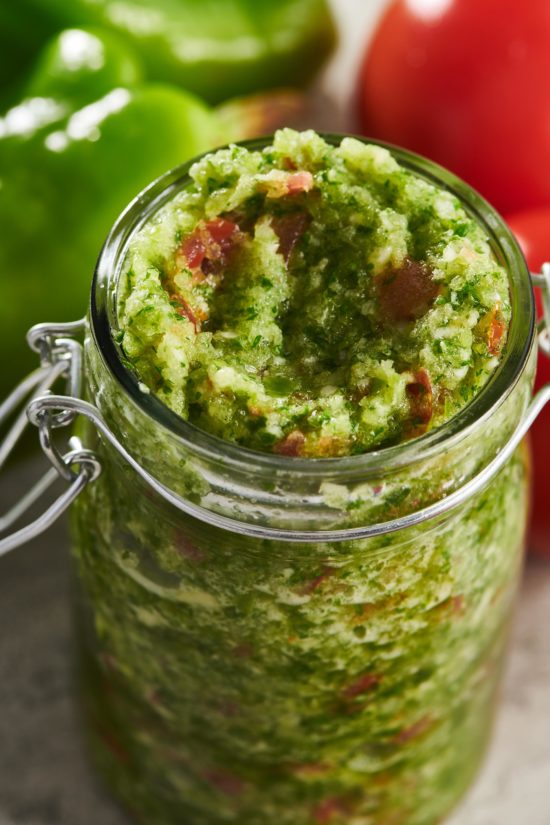 Sofrito in a glass jar with the lid off.