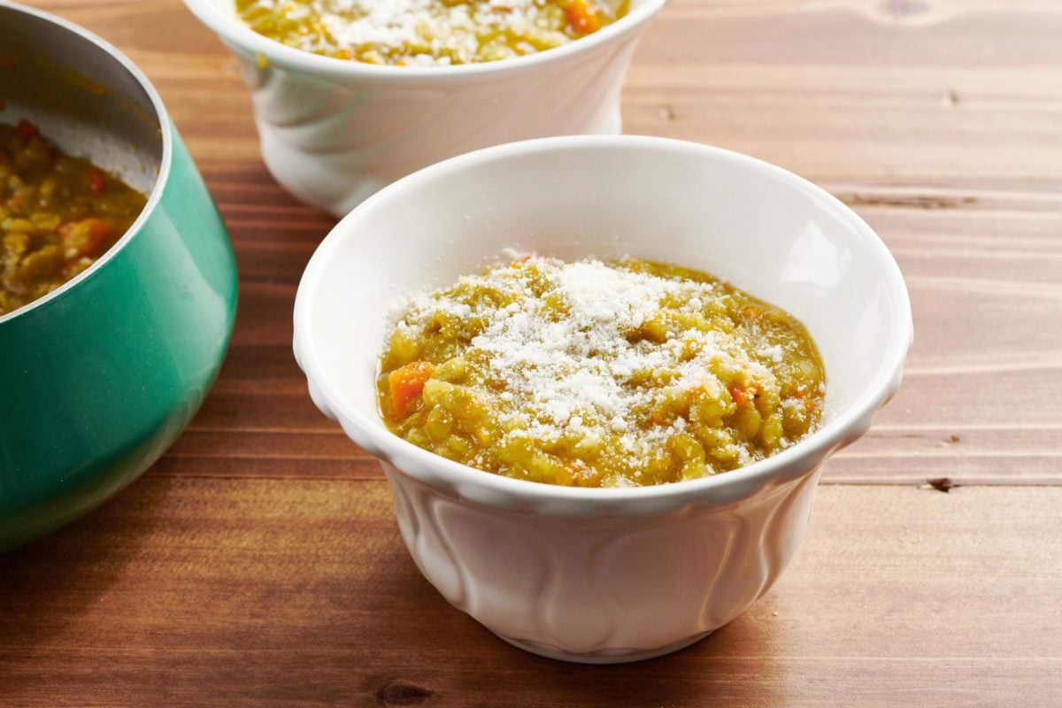 Two bowls of Vegetarian Split Pea Soup topped with Parmesan.