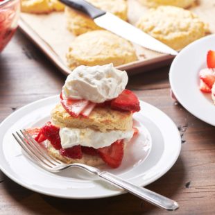 Small white plate with Strawberry Shortcake and a fork.