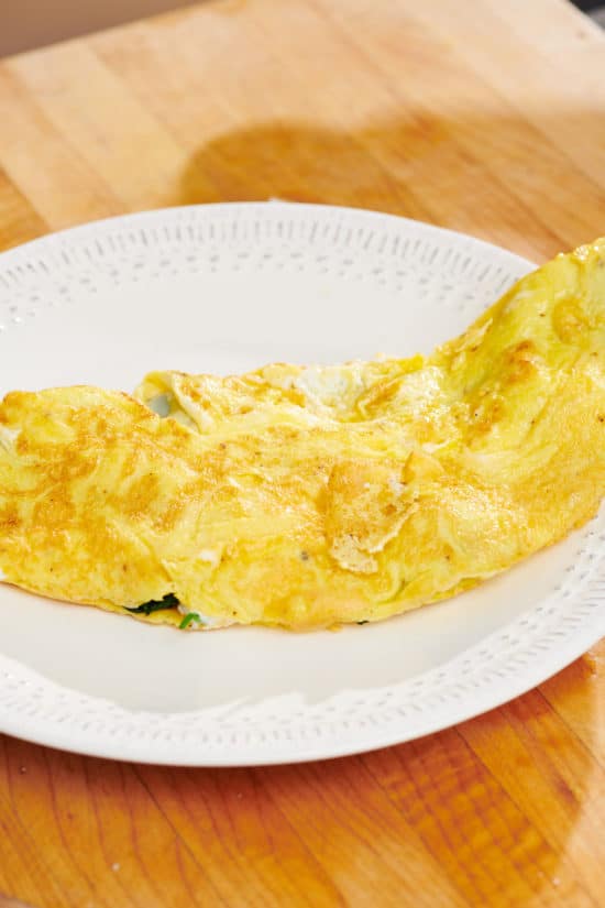 Omelet on a small, white plate.