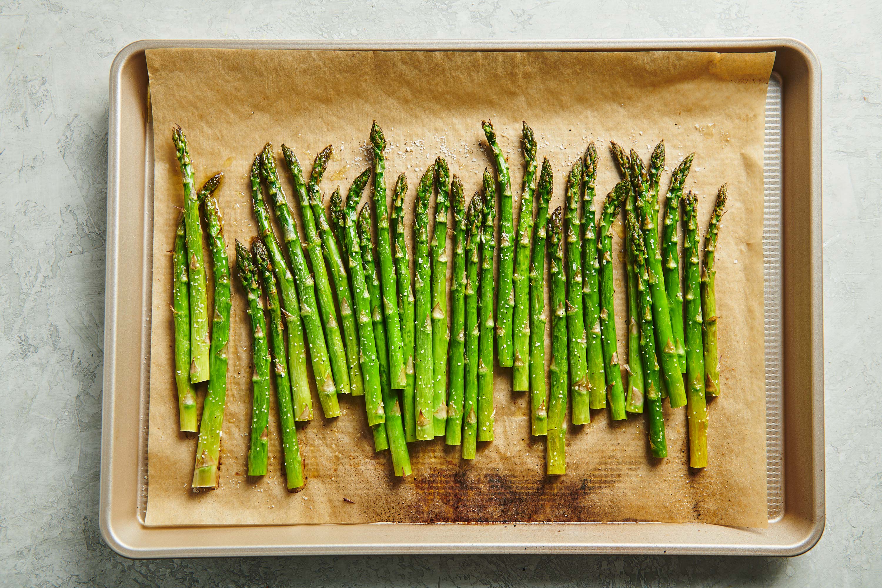 Roasted Asparagus on baking pan.