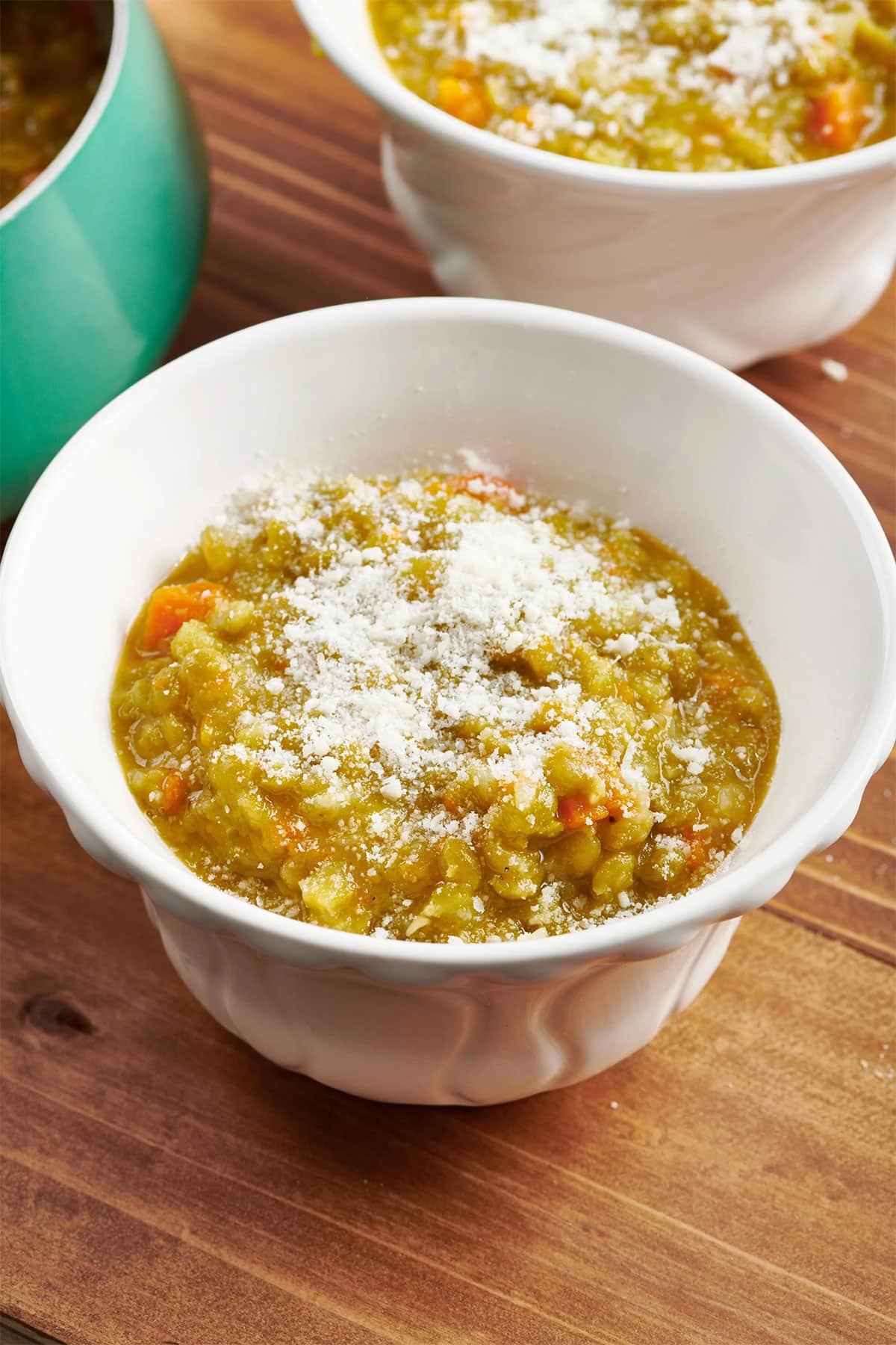Vegetarian Split Pea Soup in bowls on wood table.
