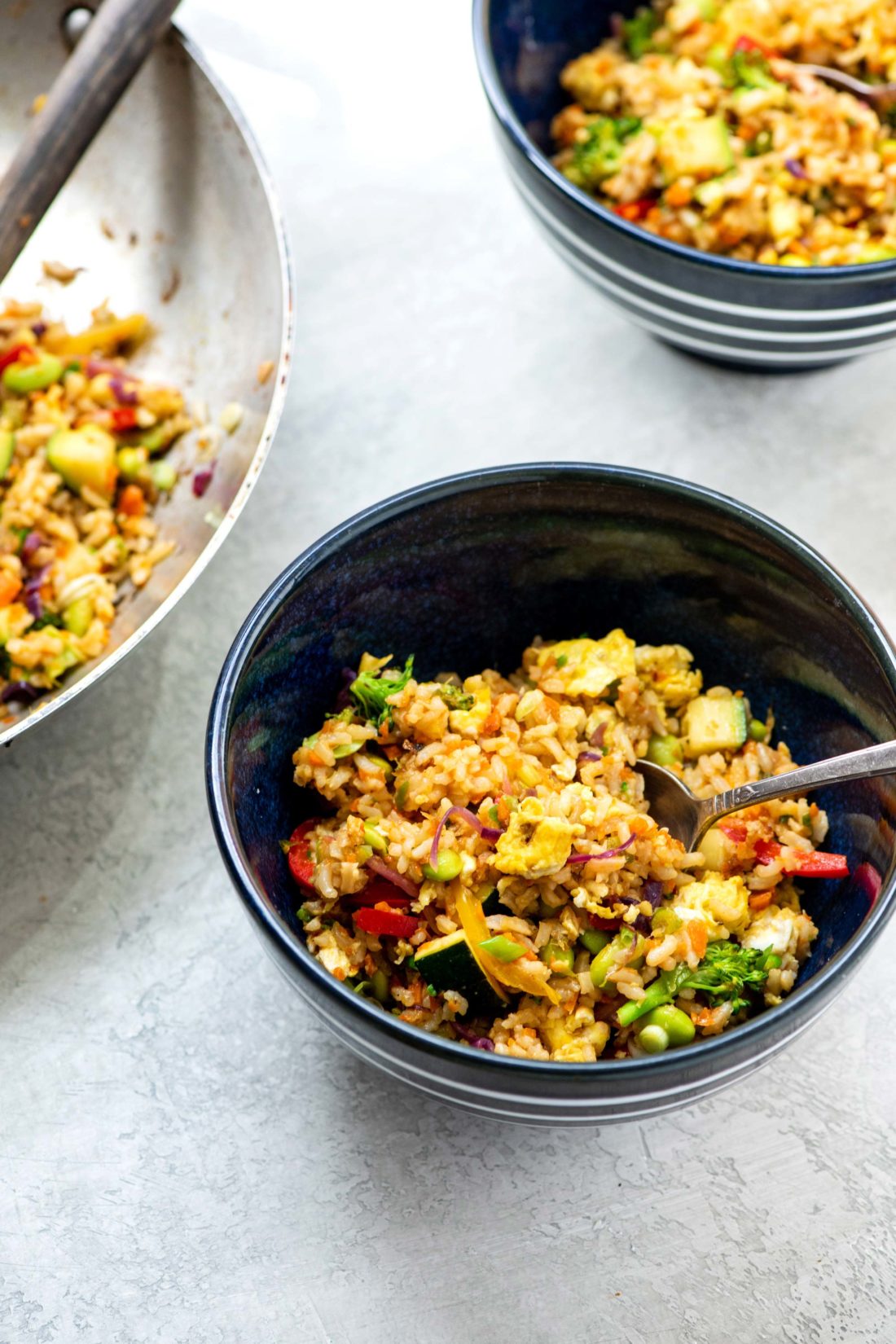 Vegetable Stir Fried Rice in a bowl with a spoon.