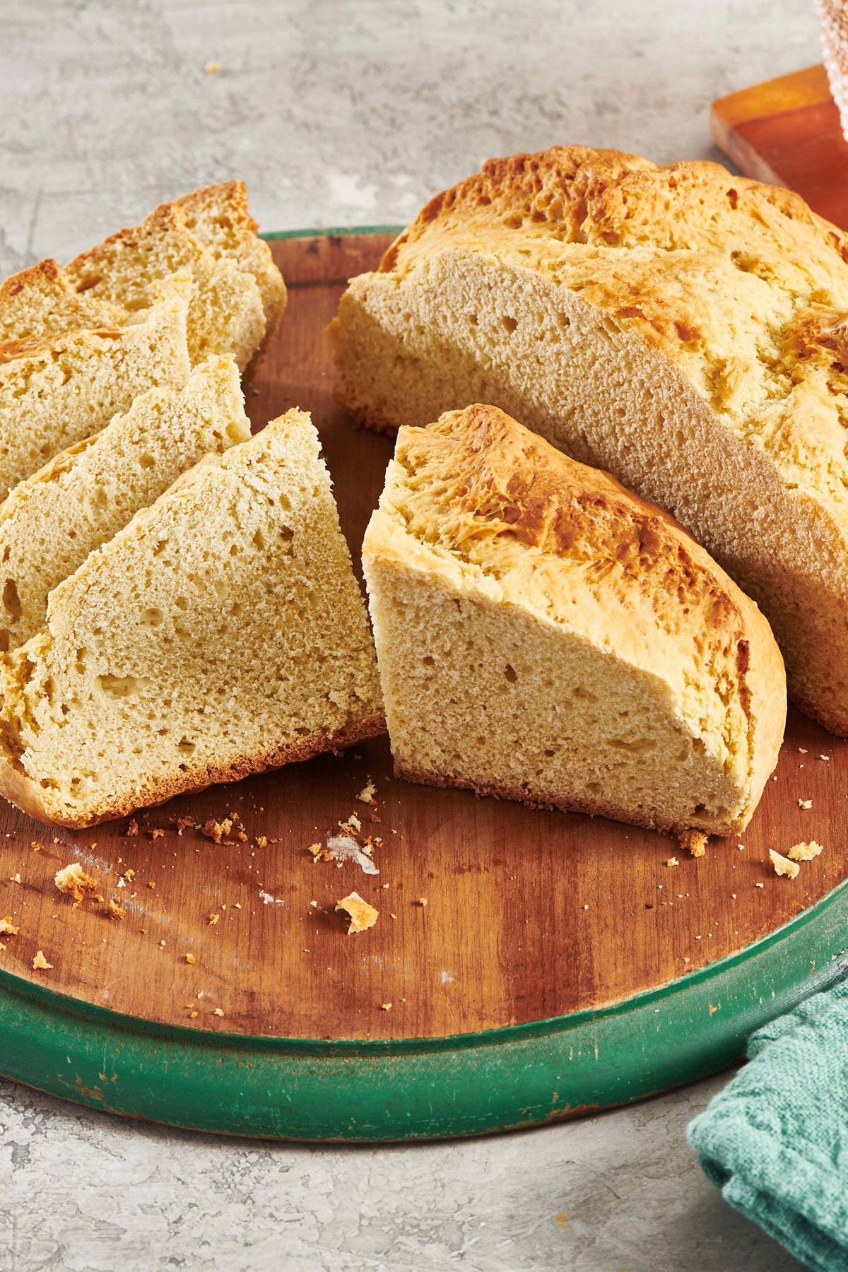 Pieces of Irish Soda Bread on a wooden board.