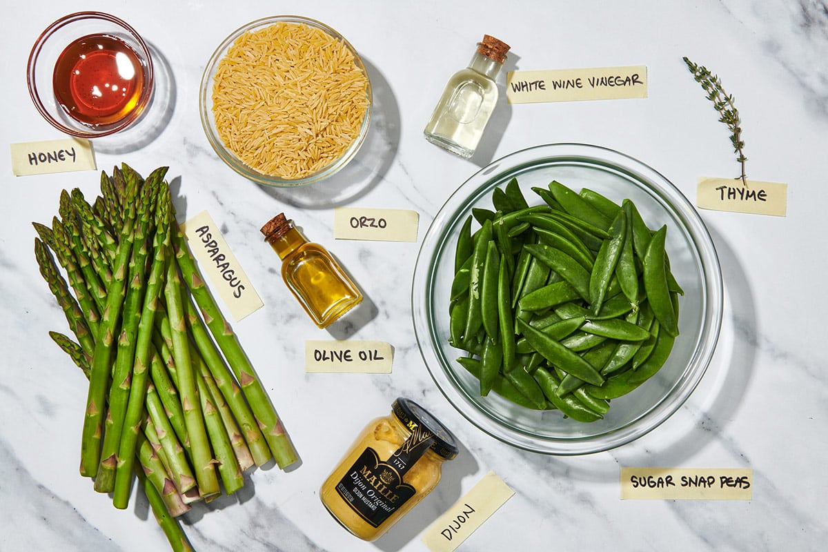 Snap peas, asparagus, orzo, and other ingredients for a fresh spring salad.