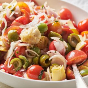 Cherry Tomato Antipasti Salad with olives, artichoke, and shallots.