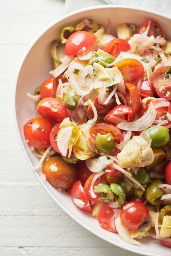 White bowl of Cherry Tomato Antipasti Salad.