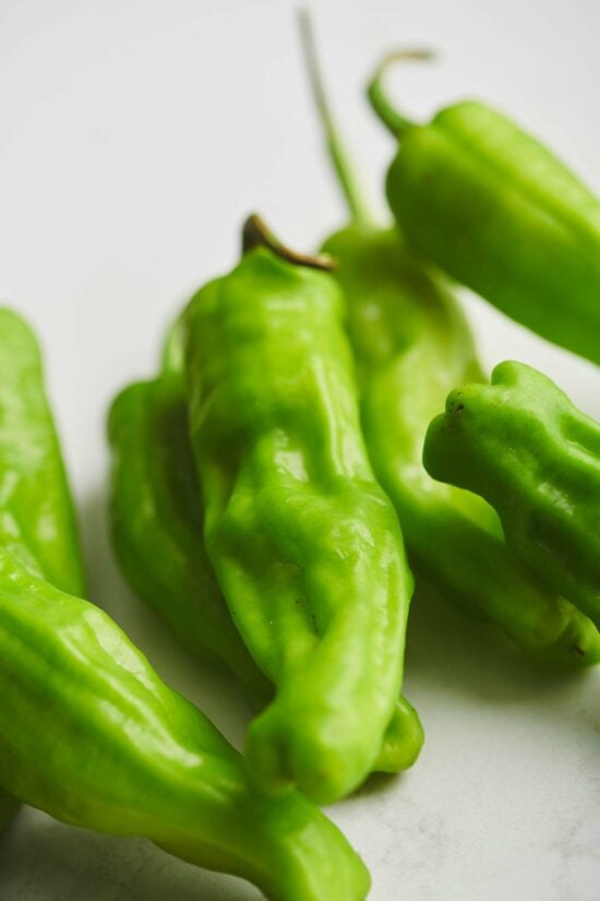 Shishito Peppers on a table.