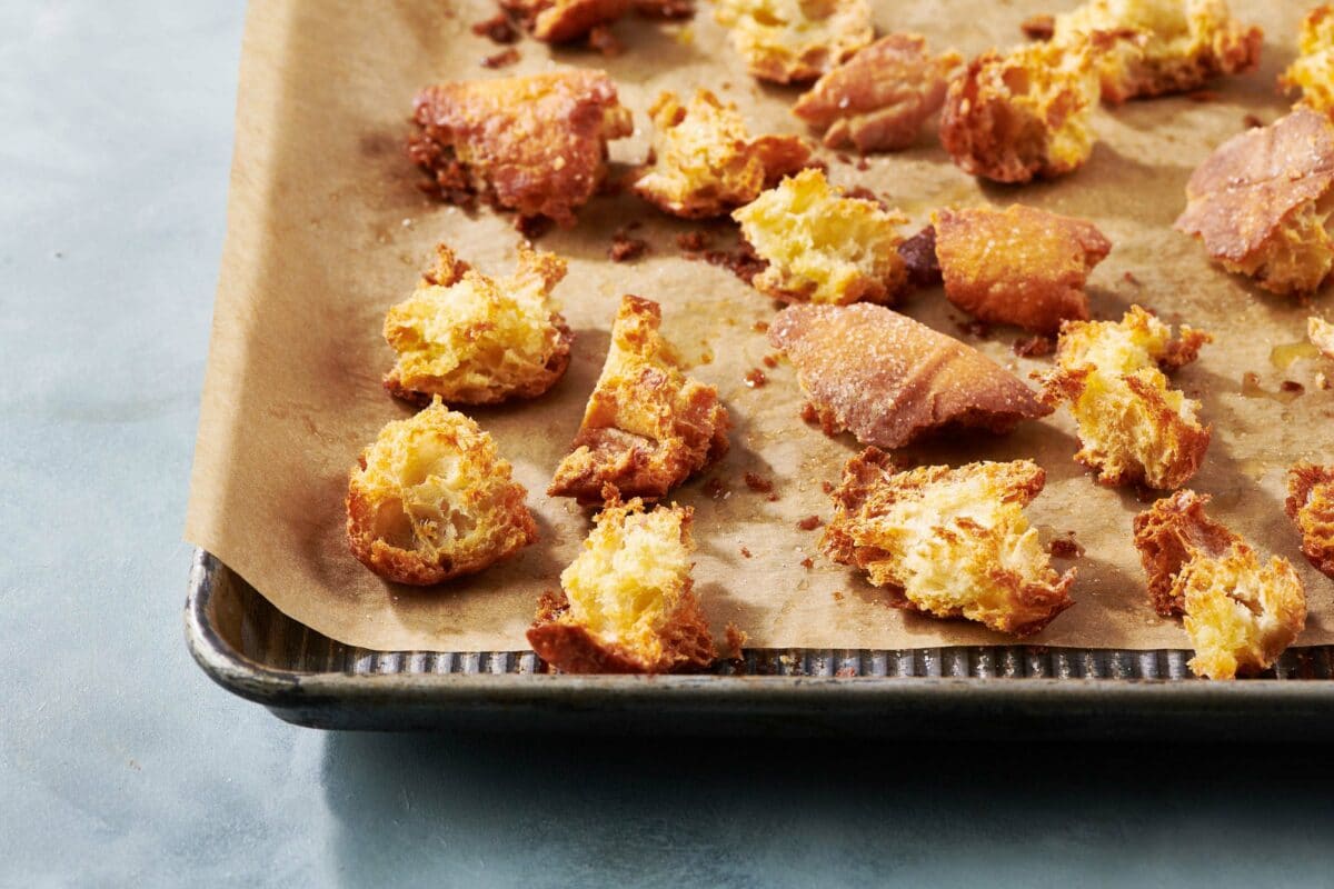Lined baking sheet of Croutons.