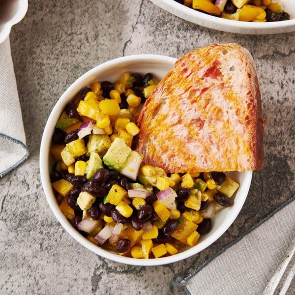 Southwest Black Bean and Corn Salad with Spanish Tomato Bread in bowl.