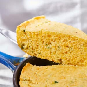 Slice of Cheddar Jalapeno Cornbread on a spatula.