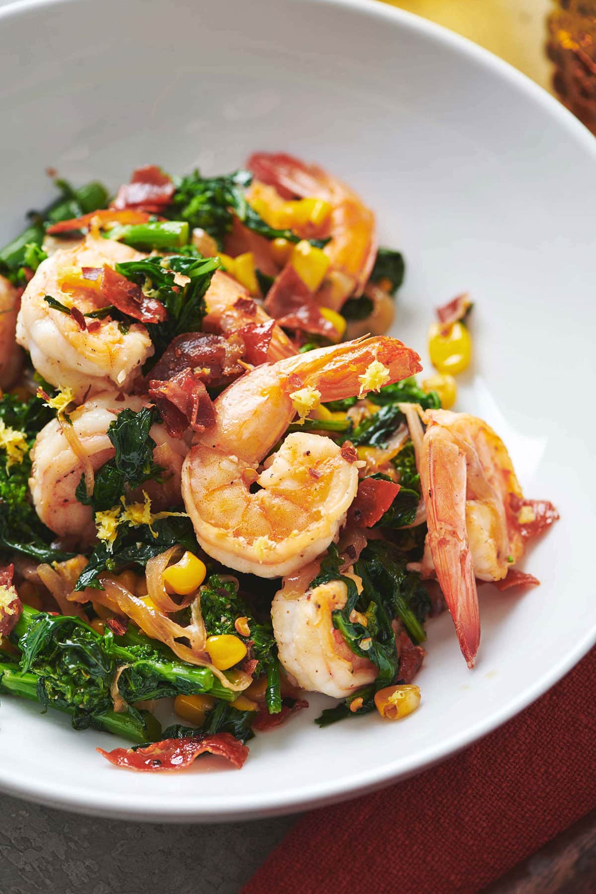 Sauteed Shrimp with Vegetables on a white plate.