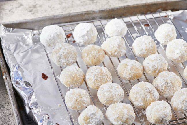 Nut-Free Snowball Cookies on a wire rack.