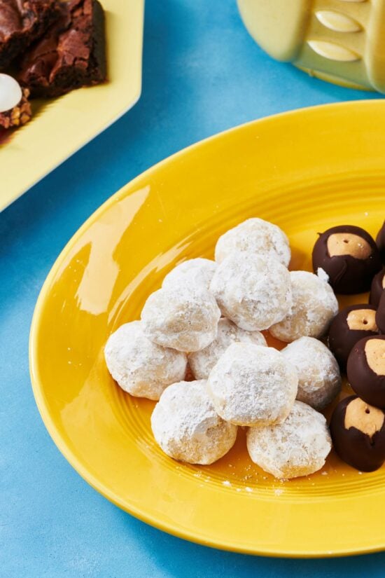 Nut-Free Snowball Cookies on a yellow dish.