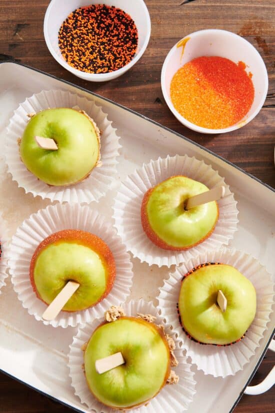 Muffin liners with Caramel Apples in a baking dish.