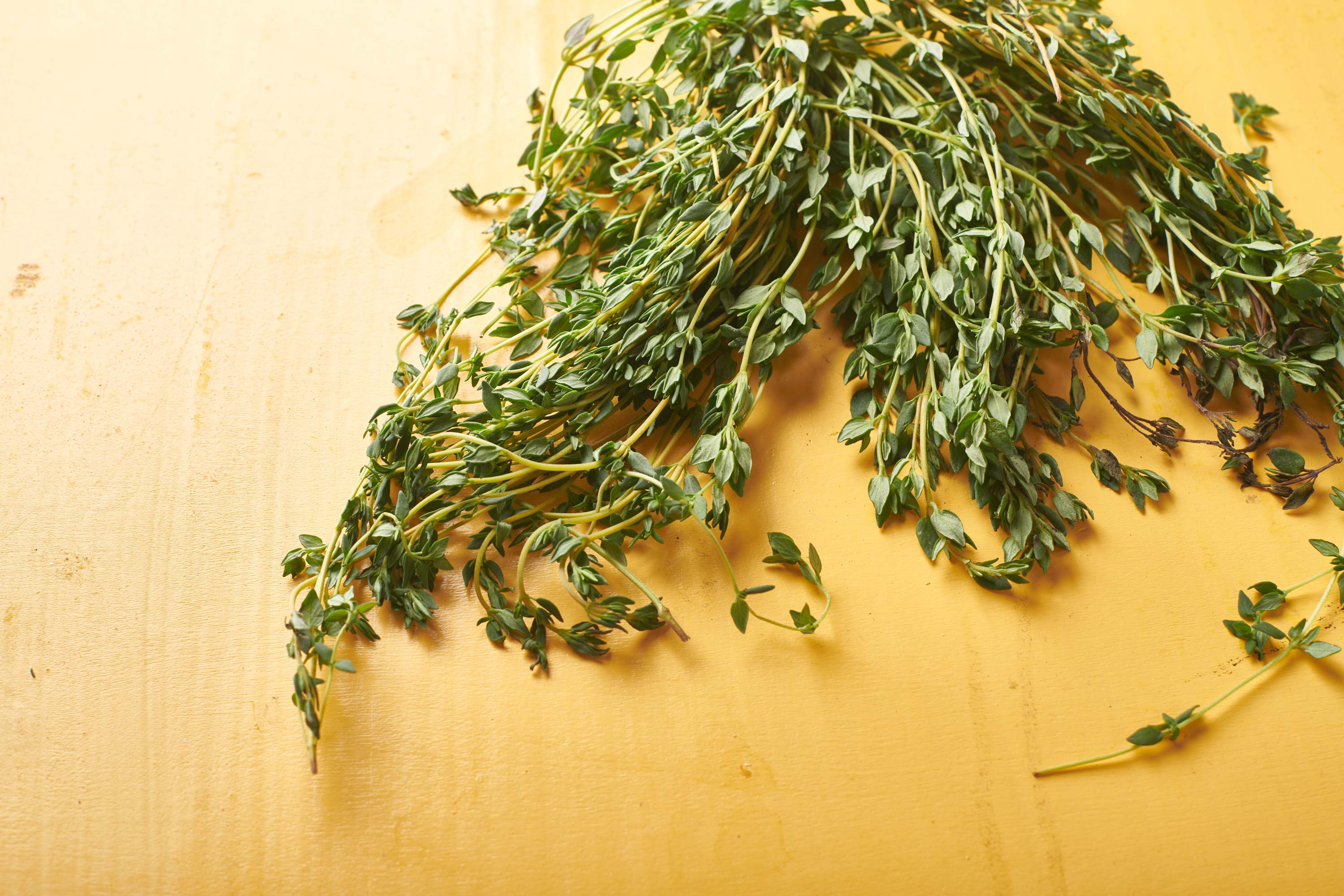 Fresh thyme on cutting board.