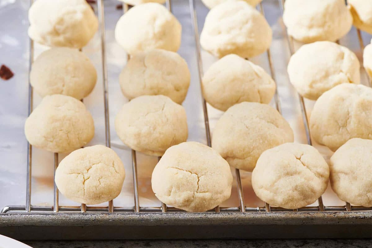 Round ball cookies on baking sheet.