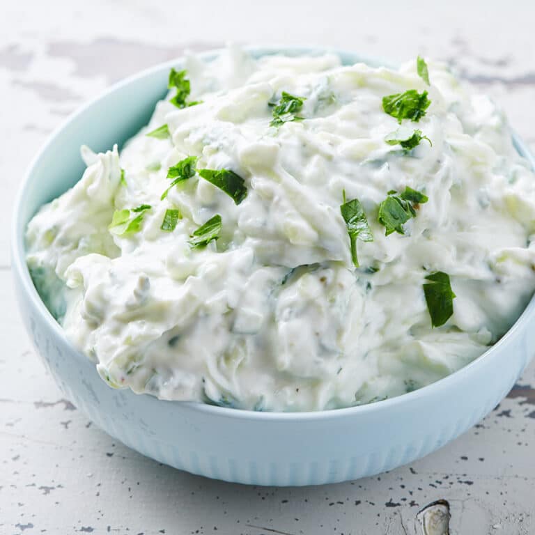 Light blue bowl of homemade Tzatziki.
