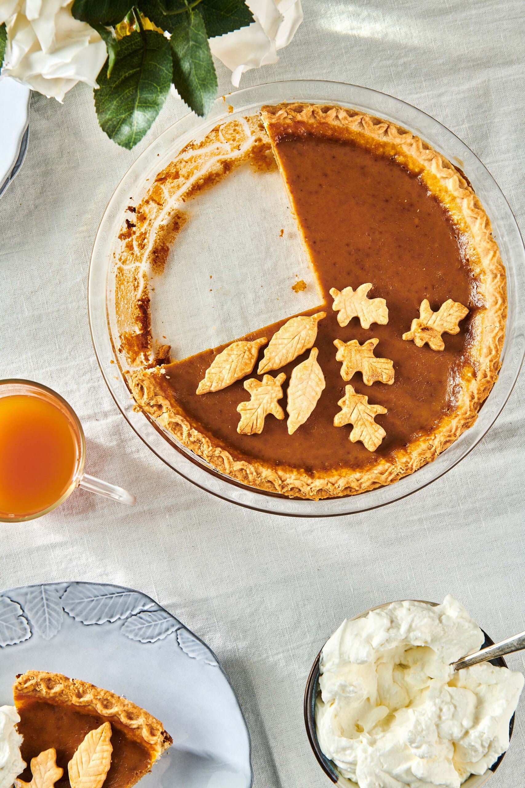 Pumpkin Pie with a quarter of the pie missing.
