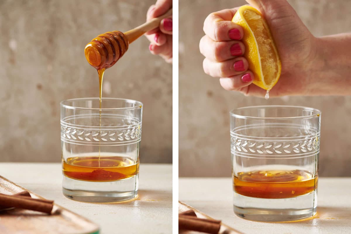 Adding honey and lemon to glass of whiskey for a hot toddy.