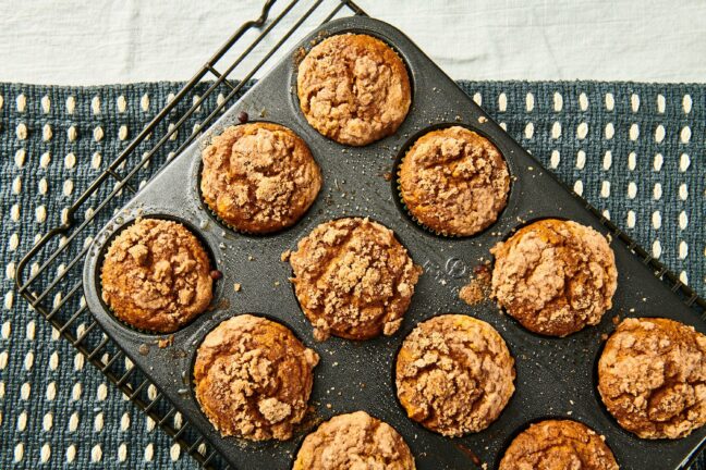 Pumpkin Streusel Muffins in a muffin pan.