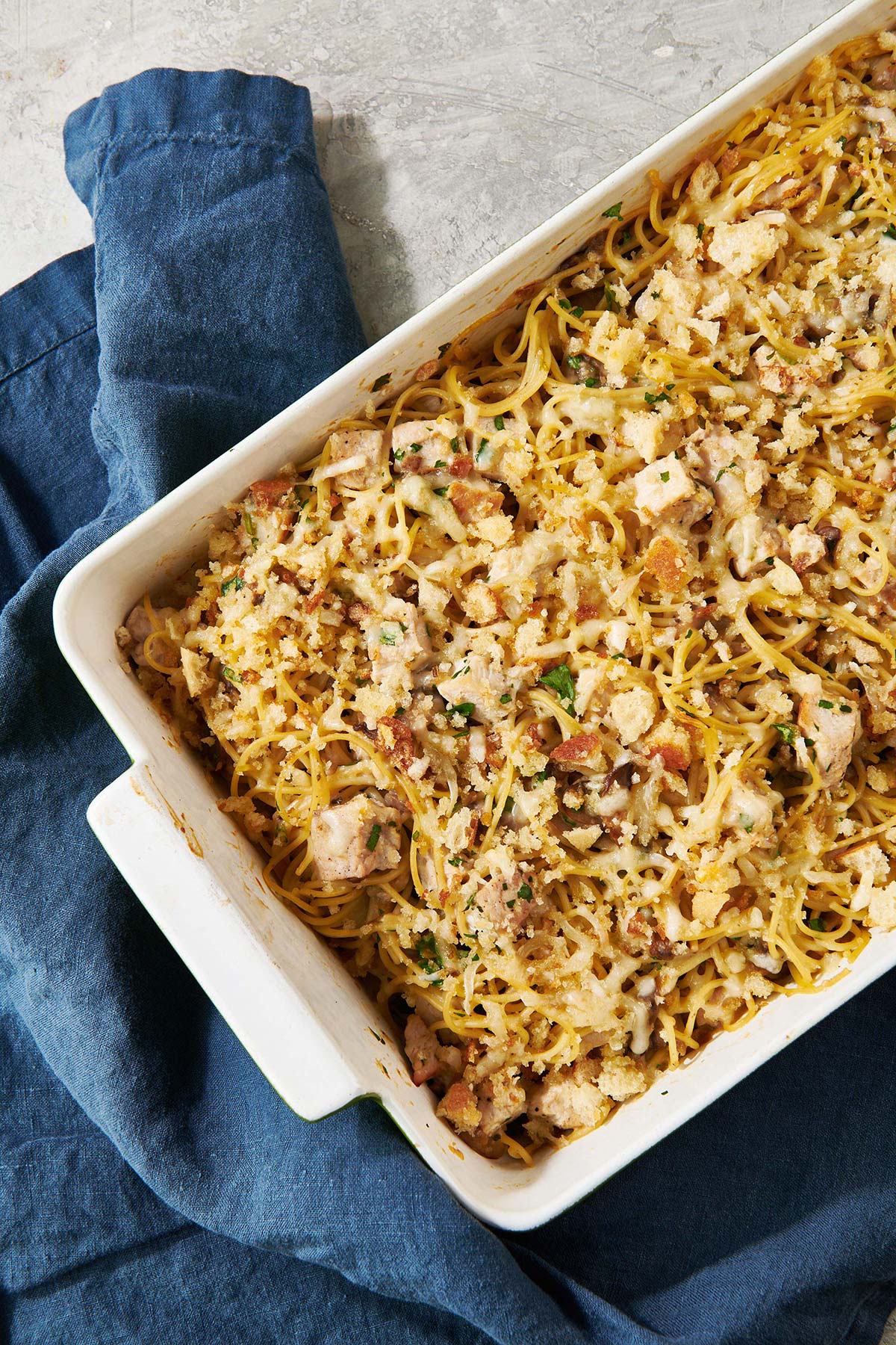 Turkey Tetrazzini in a white baking dish.