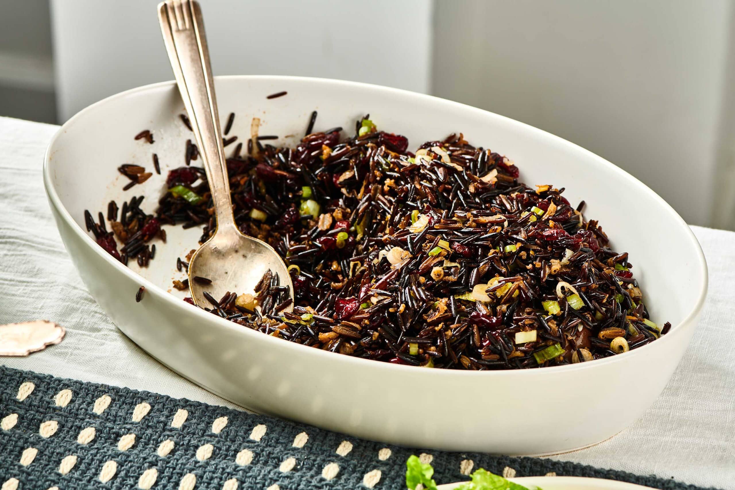 Wild Rice Salad with Cranberries in serving dish on table.