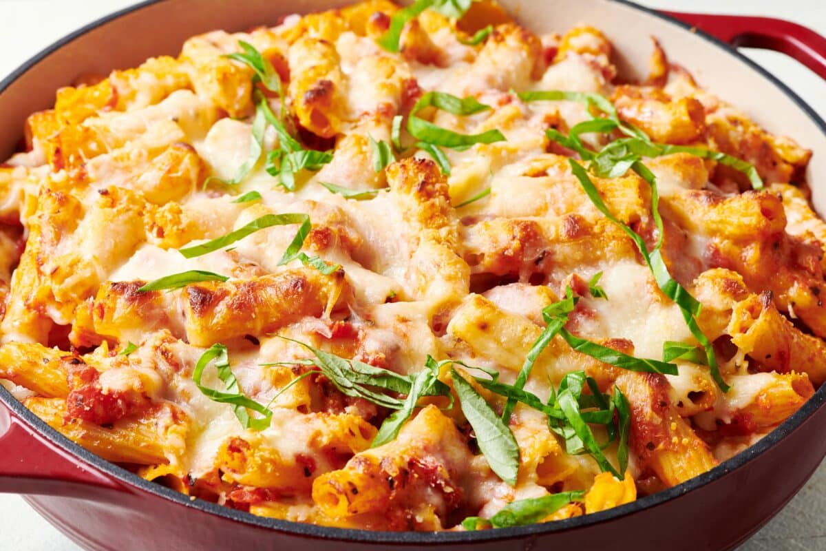 Baked Ziti garnished with thinly sliced basil.