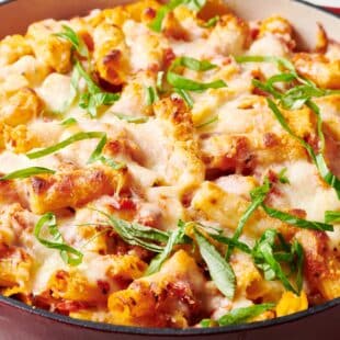 Baked Ziti garnished with thinly sliced basil.