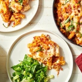 Baked Ziti in a skillet and on plates.