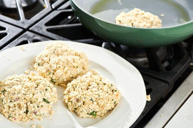 Uncooked Crab Cakes on a plate.