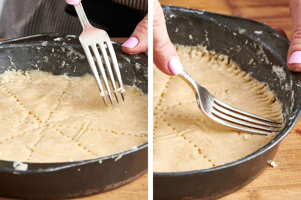 Woman scoring shortbread cookie dough with a fork.