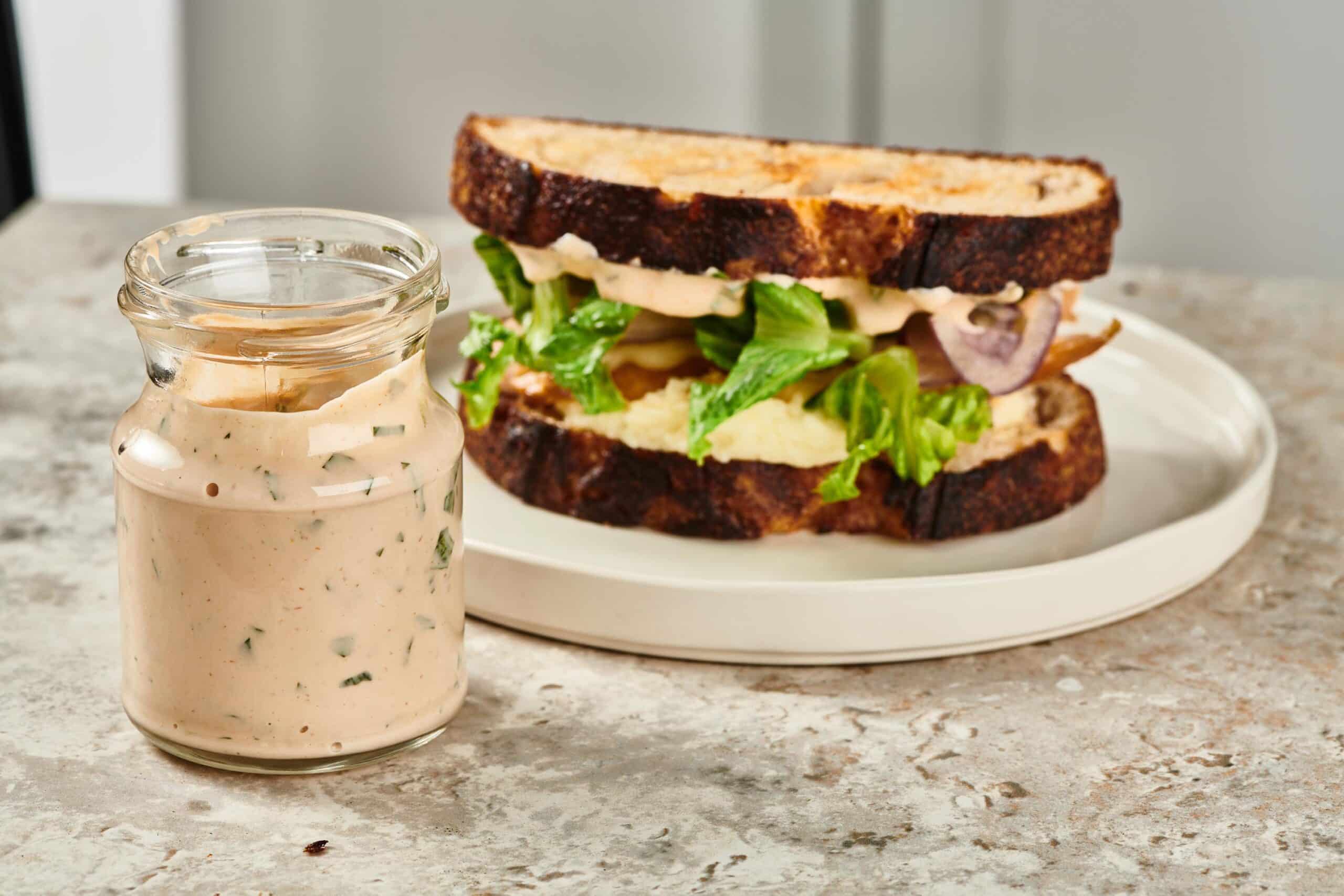 Remoulade Sauce in a jar and as a spread on a turkey sandwich.