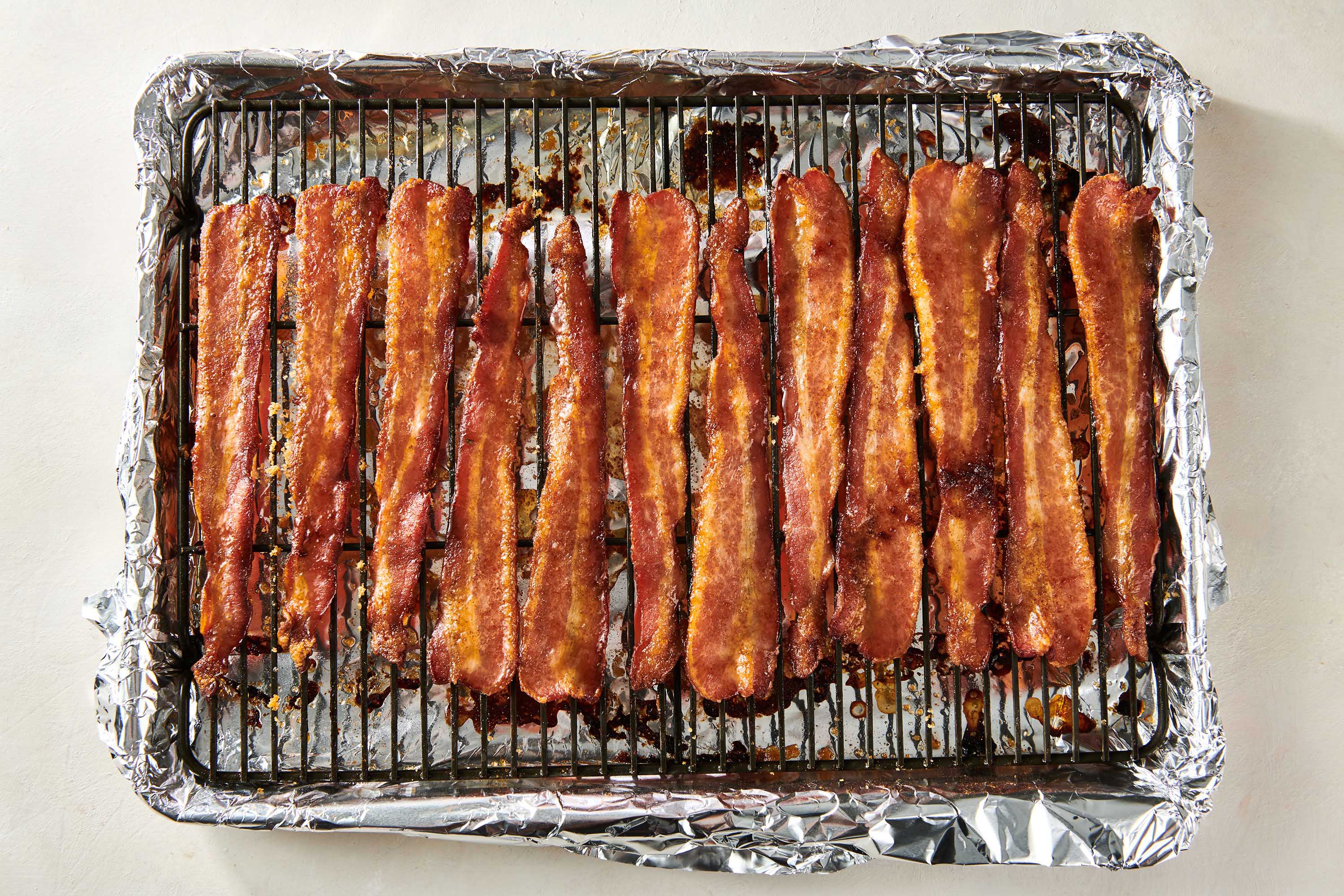 Candied Bacon on wire rack and baking sheet.
